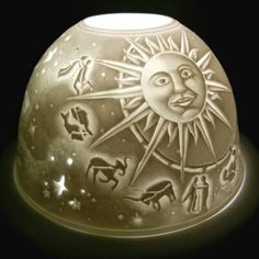 a white vase with an image of the sun and moon on it's side