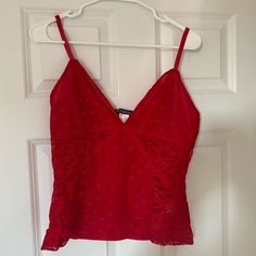 Never Worn. No Tags On It. Large. Sexy Top Revealing Cleavage Red Sleeveless Camisole For Party, Red Cami Top For Party, Chic Red Tank Top For Night Out, Flirty Cami Tank Top For Date Night, Flirty Camisole Top For Date Night, Red Camisole For Summer Party, Flirty Red Tank Top For Spring, Flirty Camisole Tank Top For Date Night, Red Cami Tank Top With Built-in Bra