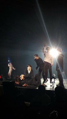 a group of people standing on top of a stage