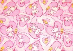 pink and yellow fabric with cartoon characters on it