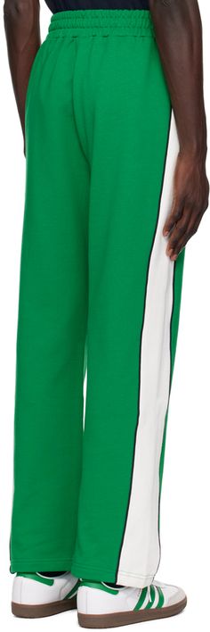 Straight-leg French terry track pants. · Concealed drawstring at elasticized waistband · Zip pockets · Logo and logo graphic screen-printed at front · Pinched seam at front legs · Piping at outseams Supplier color: Green Green Sweatpants With Side Stripes For Streetwear, Billionaire Boy, Billionaire Boys Club, Pants Straight, Logo Graphic, Track Pants, French Terry, Piping, Zip Pockets