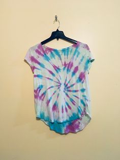 Hand tie dyed top size small, very soft Spring Faded Bleached Top, Faded Bleached Top For Spring, Blue Casual Watercolor Print Top, Blue Casual Top With Watercolor Print, Casual Blue Watercolor Print Top, Spring Tie-dye Washed T-shirt, Spring Washed Tie Dye T-shirt, Casual Tie Dye Watercolor Print Top, Casual Tie Dye Top With Watercolor Print