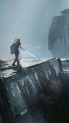 a man with a light saber standing on top of a building