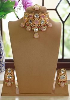 Dazzling kundan Polki stones with crystal-work teamed with a delicate gold frame instantly elevate any outfit. The set includes a pair of matching earrings and Maang Tika  Approximate earrings length is 2.5 inch Free Shipping A set that has been designed with attention to detail and will compliment any outfit! Kundan Necklaces With Gota Work For Celebration, Gold Kundan Necklace With Zari Work For Designer Wear, Bollywood Style Designer Jewelry With Gota Work, Designer Zari Work Chandbali Jewelry, Gold Chandbali Bridal Necklace, Gold Chandbali Bridal Necklace For Designer Wear, Gold Meenakari Necklace For Designer Wear, Gold Designer Necklace For Diwali, Designer Gold Necklace For Diwali