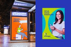 a bus stop with an advertisement on the side and a woman using her cell phone