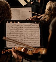 a group of people playing musical instruments together