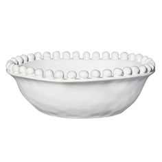 a white bowl with balls in it