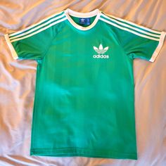 Never Worn Sporty Green Summer Shirt, Sporty Green T-shirt With Three Stripes Branding, Casual Green Adidas T-shirt, Casual Green Adidas Tops, Green Casual Top With Three Stripes, Casual Green Top With Three Stripes, Green Adidas Cotton T-shirt, Adidas Green Cotton T-shirt, Adidas Green Short Sleeve T-shirt