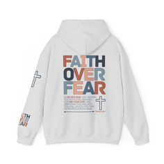 Faith Over Fear Hoodie: Embrace Courage in Every Step Confront the challenges of life with unwavering faith wearing our Faith Over Fear Hoodie, adorned with the empowering words of Isaiah 41:10. Crafted from a premium hoodie, this garment becomes a symbol of courage, a reminder that faith has the power to overcome fear. Whether you're seeking warmth or making a bold statement, this hoodie wraps you in comfort and a message of strength, inspiring you to face every day with faith prevailing over fear. Key Features: Empowering Verse: Isaiah 41:10 elegantly displayed, transforming your hoodie into a wearable source of courage and inspiration. Premium Comfort: Revel in the softness and coziness of our hoodie, providing a warm embrace on cooler days. Bold Design: A powerful yet simple design tha Fall Hoodie With Lettering, Inspirational Cotton Hoodie For Winter, Inspirational Long Sleeve Hoodie For Fall, Inspirational Letter Print Hoodie For Fall, Inspirational Graphic Print Hoodie For Fall, Inspirational Cotton Winter Hoodie, Inspirational Hoodie Sweatshirt For Fall, Inspirational Hoodie For Fall Streetwear, Inspirational Graphic Print Hoodie For Winter