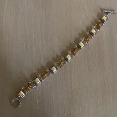 Rare John Hardy 925 Sterling Silver Toggle Bracelet With Citrine & 22k Gold Stations. Approx Length 7.75 Inches. Just Lovely! Free Poshmark Authentication Prior To Receipt Of Bracelet. Includes Jh Dust Bag. Nwot No Trades. Final Sale. Gold Bracelet With Sterling Silver Clasp For Gift, Gold Bracelet With Sterling Silver Clasp As A Gift, Gold Bracelets With Sterling Silver Clasp For Gift, Elegant Gold Chain Bracelet With Sterling Silver Clasp, Classic Yellow Jewelry With Jubilee Bracelet, Yellow Jewelry With Silver Beads For Gift, Handmade Gold Beaded Bracelets For Formal Occasions, Formal Handmade Gold Beaded Bracelets, Handmade Gold Sterling Silver Bracelets