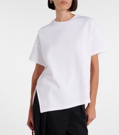 Cotton-blend T-shirt in white - Loewe | Mytheresa Tan Cotton Crew Neck Top, Modern Cotton T-shirt With Short Sleeves, Modern Relaxed Fit Cotton Tops, Modern Cotton Top With Relaxed Fit, Trendy Tan Cotton Top, Modern White Cotton T-shirt, Modern Cotton Short Sleeve Tops, Modern Short Sleeve Cotton Tops, Sporty Tan Cotton Tops