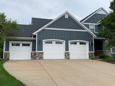 a house with two garages and three windows