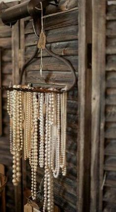 a wooden wall with beads hanging from it