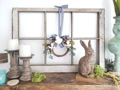 an old window frame is decorated with easter decorations