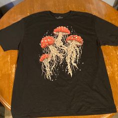 Mushroom/Psychedelic Print. Never Worn Or Tried On Casual Short Sleeve Top With Mushroom Design, Casual Crew Neck Shirt With Mushroom Print, Casual Relaxed Fit Shirt With Mushroom Print, Black Short Sleeve Top With Mushroom Print, Black Crew Neck Top With Mushroom Print, Casual Crew Neck T-shirt With Mushroom Design, Black Graphic Tee With Mushroom Print, Cute Short Sleeve T-shirt With Mushroom Print, Streetwear Mushroom Print Short Sleeve T-shirt