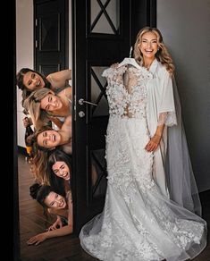 the bride is posing with her bridal party friends in front of an open door