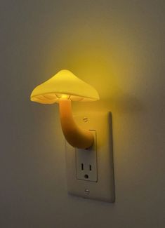 a mushroom shaped light is on the wall