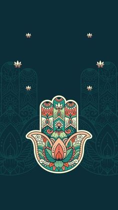 a hamsa on a dark background with leaves