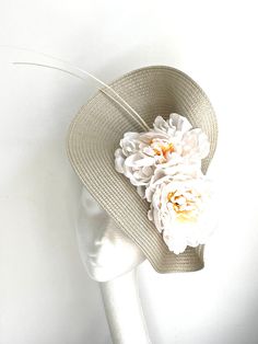 Natural Beige Feather Saucer Disc Hat This natural beige feather saucer disc hat is made of polybraid to which I attached off-white flowers and feathers. The saucer disc hat is attached to the silk-covered headband. There is a comb attached to the headband for extra security. Beige Feather Saucer Disc Hat will be an amazing accessory to compliment your outfit. The colors can easily pick the colours you would be wearing. A Beige Feather saucer disc hat will fit the average head size. Enjoy your s Luxury Beige Brimmed Fascinator, Beige Mini Hats For Church In Summer, Summer Beige Mini Hats For Church, Adjustable Brimmed Cream Fascinator, Curved Brim Cream Fascinator For Spring, Cream Short Brim Fascinator For Beach, Cream Brimmed Adjustable Fascinator, Cream Curved Brim Fascinator For Spring, Spring Cream Fascinator With Curved Brim