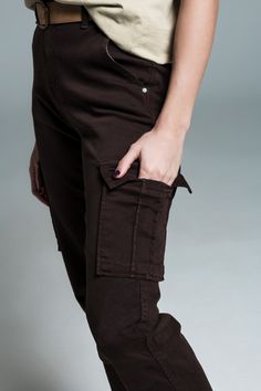 Introducing our Dark Brown Cargo Pants, an essential addition to any fashion-forward wardrobe that values both style and practicality. Quality Material: These cargo pants are expertly crafted from 98% Cotton and 2% Elastane, ensuring both durability and comfort. The addition of elastane provides that extra bit of stretch, making these pants perfect for active wear or a busy day out. Versatile Pocket Design: Equipped with six functional pockets, these cargo pants offer ample storage for your esse Brown Cargo Pants, Types Of Jeans, Knitwear Tops, Cargo Jeans, Hat Hairstyles, Cargo Pants, Stretch Denim, Jacket Dress, Daily Wear