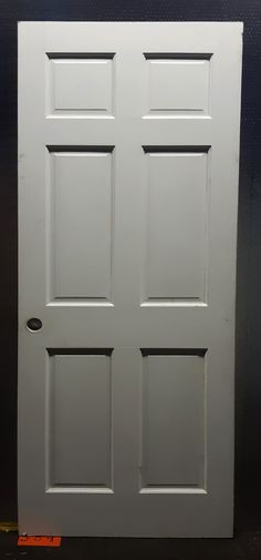 an image of a white door that is painted to look like it has four panels