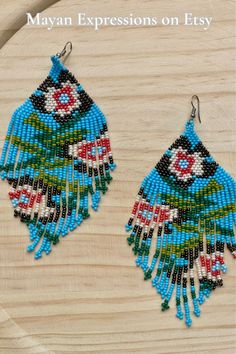 Thank you for your support! Check out Mayan Expressions on Etsy for more colors and designs. Traditional Flower Shaped Beaded Earrings, Traditional Beaded Flower Drop Earrings, Traditional Beaded Drop Flower Earrings, Traditional Turquoise Teardrop Beaded Earrings, Traditional Flower Shaped Earrings For Festivals, Traditional Flower Earrings For Festival, Traditional Flower-shaped Earrings For Festivals, Traditional Green Flower Earrings, Traditional Handwoven Turquoise Earrings