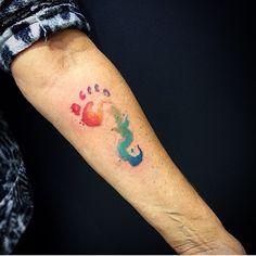 a person with a colorful tattoo on their arm