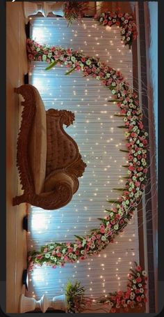 a decorated room with flowers and lights on the wall