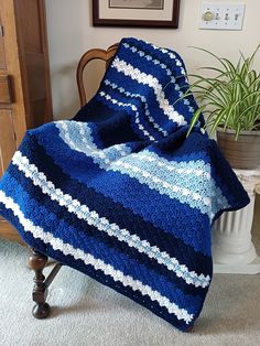 Soothing Shells Blanket crochet pattern features shades of blue with white in a small shell pattern to create a reversible, close textured blanket that all but beckons you to come cuddle up and say "Ah-h-h". The pattern recommends Caron One Pound yarn. The finished blanket measures 43.5" x 72" but can be adjusted to be larger or smaller. The Bliss Blanket series was created to bring you select heirloom quality crochet blanket patterns that exemplify grace and beauty. Filled with your love, these blankets will immerse its welcoming guests into a world of comfort, peace, tranquility and love. These heart-warming blanket patterns are simple enough for most beginners to follow to create professional looking results. Difficulty Level ~ Beginner, Easy 4 pages in the PDF download file. When order Blue Crochet Blanket, Caron One Pound Yarn, Scrap Crochet, Blankets Crochet, Beau Crochet, Crochet Throw Pattern, Crochet Stitches For Blankets, Crochet Blanket Designs, Crochet Blanket Pattern