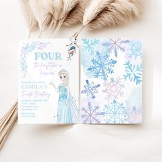 a frozen princess birthday party with snowflakes, feathers and an ice queen card