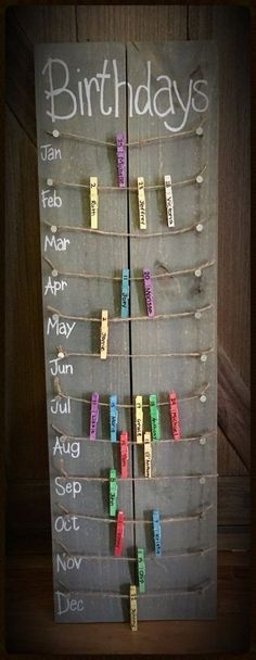 a birthday sign with clothes pins attached to it