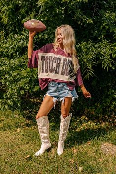 - Show off your team spirit in this dazzling oversized 'TOUCHDOWN' tee! Featuring a sequined design and chic unfinished seam accents, you'll shine on game day. - Unlined lightweight material with unfinished seam accents - A sequined 'TOUCHDOWN' design across the front - Short drop sleeves - An oversized silhouette that ends in an unfinished hemline - This piece is perfect for fans of Mississippi State, Texas A&M, South Carolina, Florida State, and more! Kids Athleisure, Touch Down, Concert Fashion, Long Sweater Dress, Summer Soiree, Mississippi State, Swimwear Dress, Sparkly Dress, Black Dresses Casual