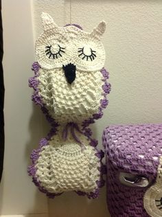 two crocheted stuffed animals sitting next to each other