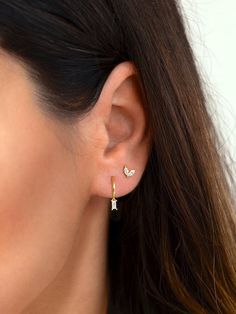 "Beautiful and classy, these tiny baguette hoop earrings are adorned with a dainty baguette charm. Layer these versatile huggie hoops with other delicate earrings to create your favourite ear stack. * Sold individually (1 hoop) or by pair (2 hoops). Both options are available on the dropdown menu. * Available with an emerald green, white or black cubic zirconia gemstone. All options are available on the dropdown menu. * D E T A I L S * ∙ Material: .925 Sterling Silver or 18K Gold Plated over .92 Earring Ideas 2 Holes, Double Ear Piercing Ideas Silver, 2 Ear Piercings Silver, Seconds Ear Piercing Silver, 2nd Hole Ear Piercing, Ear Piercings First And Second, Small Earlobe Piercings, Dainty Huggie Earrings, Baguette Huggie Earrings