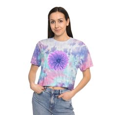 This icon of the 60s is back with a beautiful violet Dahlia flower printed on the front and back.  Made with 60% cotton and 40% polyester, this tee balances perfectly between comfy and stretchy, making it an excellent all-around choice for casual wearing. Each tee comes pre-shrunk for no size-related surprises after repeated washes, and features a drop shoulder sleeve for laid-back vibes.  .: 60% Cotton 40% Polyester .: Light fabric (5.4 oz/yd² (183 g/m .: Relaxed fit .: Sewn-in label Because this t-shirt is custom printed for your size, there are no returns or exchanges.  Please contact us with any issues. .: Shirt colors and pattern may vary Casual Tie Dye Tops With Floral Print, Casual Tie Dye Crop Top For Spring, Spring Tie-dye Tops With Watercolor Print, Spring Tie Dye Top With Watercolor Print, Tie Dye Floral Print Summer Top, Tie Dye Floral Print Top For Summer, Summer Floral Print Tie Dye Top, Casual Tie-dye Short Sleeve Crop Top, Trendy Tie Dye Crop Top For Spring