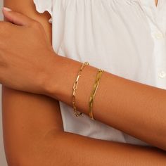 Description Stay stacked! Two perfectly paired bracelets instantly elevate any outfit. Product Details Parker Bracelet Total length 7 1/4" Links measure 3/8" by 1/8" Hinge closure measures 1/2" Available in 18k gold plated brass Avoid contact with anything containing derivatives of alcohol Venice Bracelet 6 1/4" chain + 1" extender Total length 7 1/4" 3/16" wide chain Lobster closure Available in 18k gold plated brass Avoid contact with anything containing derivatives of alcohol Modern Paperclip Bangle Bracelet For Everyday, Classic Bangle Bracelet, Earrings Stacking, Black Labradorite, Gold Bracelet Set, Orange Agate, Iridescent Crystal, Snowflake Obsidian, 14k Gold Necklace