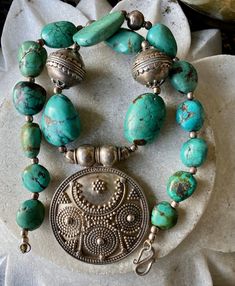 * Bold Beautiful   Ethnographic  chunky sterling silver TURQUOISES Large Madalion vintage Necklace This piece is stunning  High qquality  Measures: 21" x 2 1/2" (53.4 x 6.3 cm) Turquoises: from 5/8" to 1 1/8" (16 to 22 mm) Sterling pendant 2 1/2" x 2" (6.3 cm x 5 cm) Weights: 173 grams Traditional Turquoise Necklace For Festivals With Silver Accents, Traditional Silver Turquoise Necklace For Festivals, Unique Antique Silver Round Necklace, Unique Antique Silver Necklace, One-of-a-kind Silver Jewelry For Festivals, One Of A Kind Silver Jewelry For Festivals, Silver Bohemian Turquoise Necklace For Festivals, Bohemian Silver Turquoise Necklace For Festivals, Vintage Sterling Silver Jewelry For Festivals