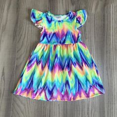 Brand New In Package Cotton/Spandex Spring Rainbow Print Short Sleeve Dress, Spring Dresses With Rainbow Print And Short Sleeves, Multicolor Ruffle Twirl Dress For Playdate, Multicolor Ruffled Twirl Dress For Playdate, Multicolor Twirl Dress For Summer Playdate, Multicolor Twirl Dress For Playdate In Summer, Fun Summer Twirl Dress For Playdate, Blue Sleeveless Dress For Beach, Rainbow Summer Dress For Playtime