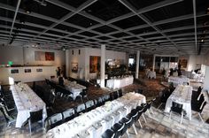 a large room with tables and chairs set up for a formal dinner or banquet event