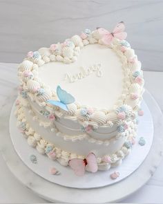 a heart shaped cake sitting on top of a white plate