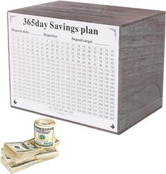 a wooden box with a stack of money next to it and the words 350 day savings plan