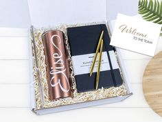 a welcome to the team gift set in a box with a pen and notepad