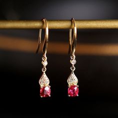 •Condition: Brand new•Center Stone: Natural Red Spinel, Cushion Cut, approx 1.6ct total, 5.5x4.5mm•Side stones: Natural White Diamond Round-cut (VS1 clarity and F color)•Earrings Dimension: 3.5 x 26 x 3mm•Metal Purity: Optional•Sell as pair Each piece is made-to-order with care and special attention to detail. all items are made with conflict-free diamonds and gems.Size: made to orderThe item will be gift wrapped and shipped.-------------------------------------------------------------------Avai Pink Gold Drop Earrings For Anniversary, Elegant Red 14k Gold Jewelry, Red Dangle Earrings For Anniversary, Elegant Ruby Earrings With Elegant Design, Ruby Earrings With Elegant Design, Red Brilliant Cut Earrings For Anniversary, Elegant Ruby Earrings For Celebrations, Elegant Pink Gold Ruby Jewelry, Elegant Red Drop Earrings