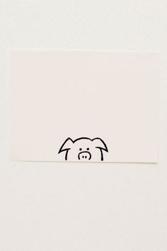 a sticker with an image of a dog's head on the side of a white wall