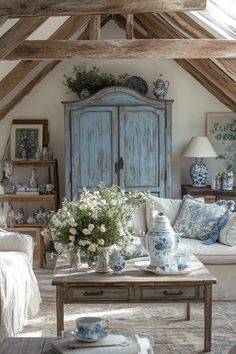 Cozy French country living room with exposed beams, ornate tables, and blue and white decor Cozy French Country Living Room, Country Farmhouse Living Room, Cozy Farmhouse Living Room, French Country Living, Country Rose, Deco Champetre, French Country Living Room, Cottage Living Rooms, French Country Farmhouse