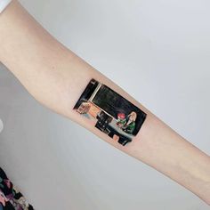 a person with a tattoo on their arm