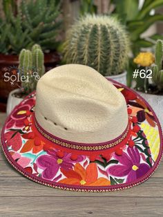 This beautiful Mexican Fedora is made out of Palm and has beautiful embroidered flowers. It is perfect to add that special touch to any outfit. The hat itself is made out of Palm and is very light and breathable. Find more colors here: https://www.etsy.com/es/listing/1002472377/sombrero-mexicano-de-palma-sombrero?ref=listing_published_alert Traditional Hats For Beach In Spring, Traditional Curved Brim Straw Hat For Spring, Summer Sun Hat With Embroidered Curved Brim, Multicolor Embroidered Brimmed Hat, Embroidered Straw Hat With Curved Brim For Summer, Embroidered Wide Brim Summer Hat, Summer Festival Hat With Floral Embroidery, Summer Embroidered Straw Hat With Curved Brim, Bohemian Embroidered Sun Hat For Spring