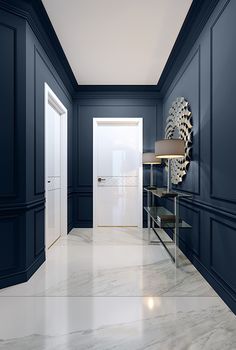 an empty room with blue walls and white marble flooring is pictured in this image