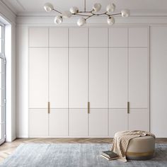 an empty room with white cupboards and a large rug on the floor in front of it