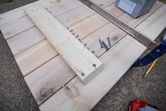 a piece of wood being worked on with tools